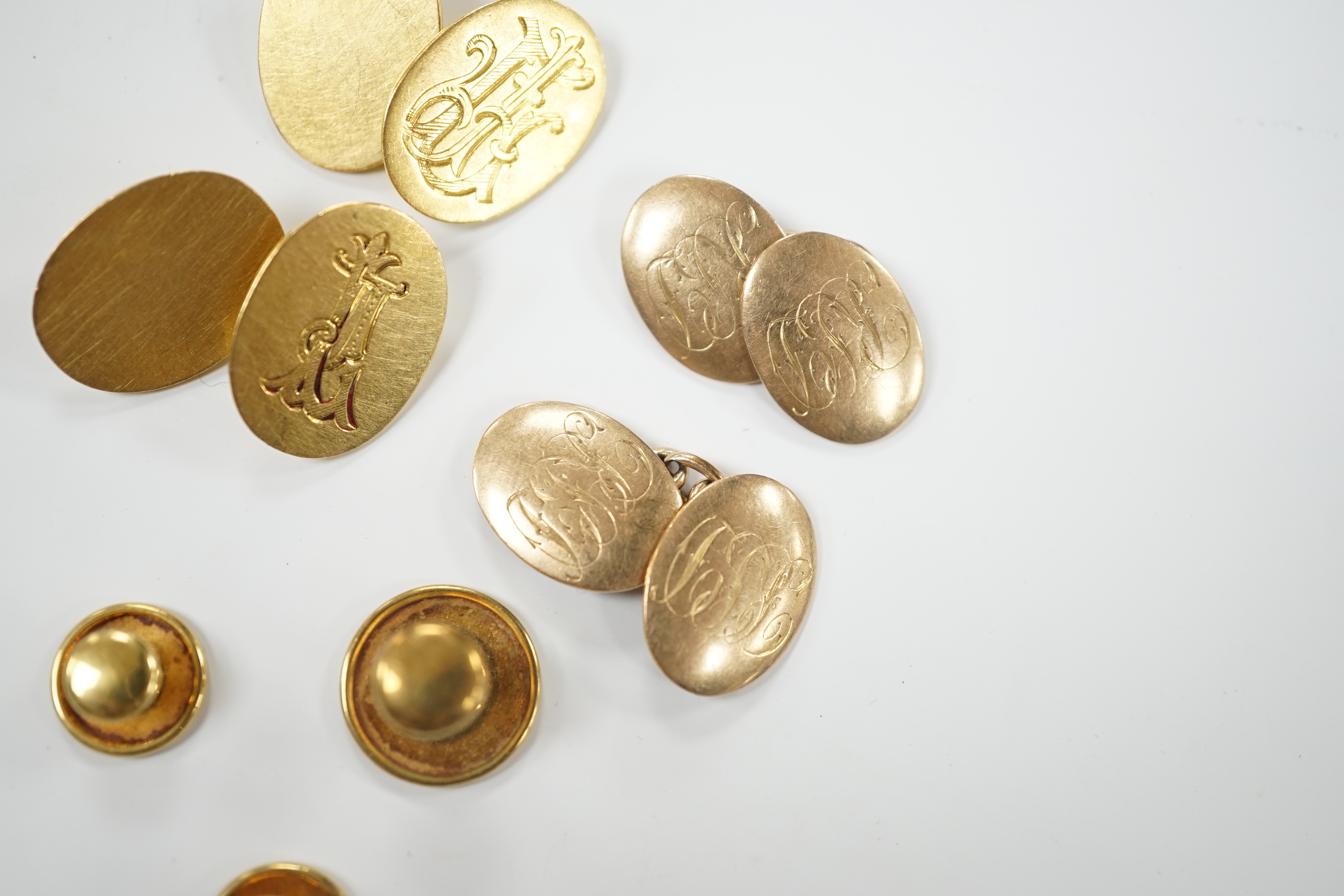 A pair of 18ct gold oval cufflinks, with engraved monogram, three 18ct dress studs and a pair of 9ct gold oval cufflinks